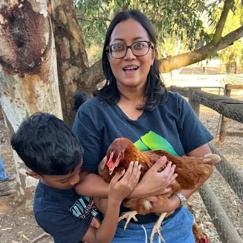 Guests holding chickens