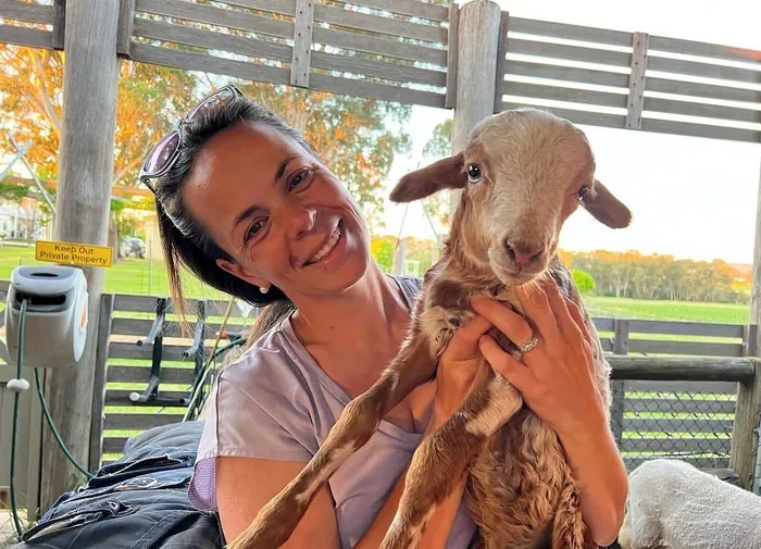 Cuddling a lamb